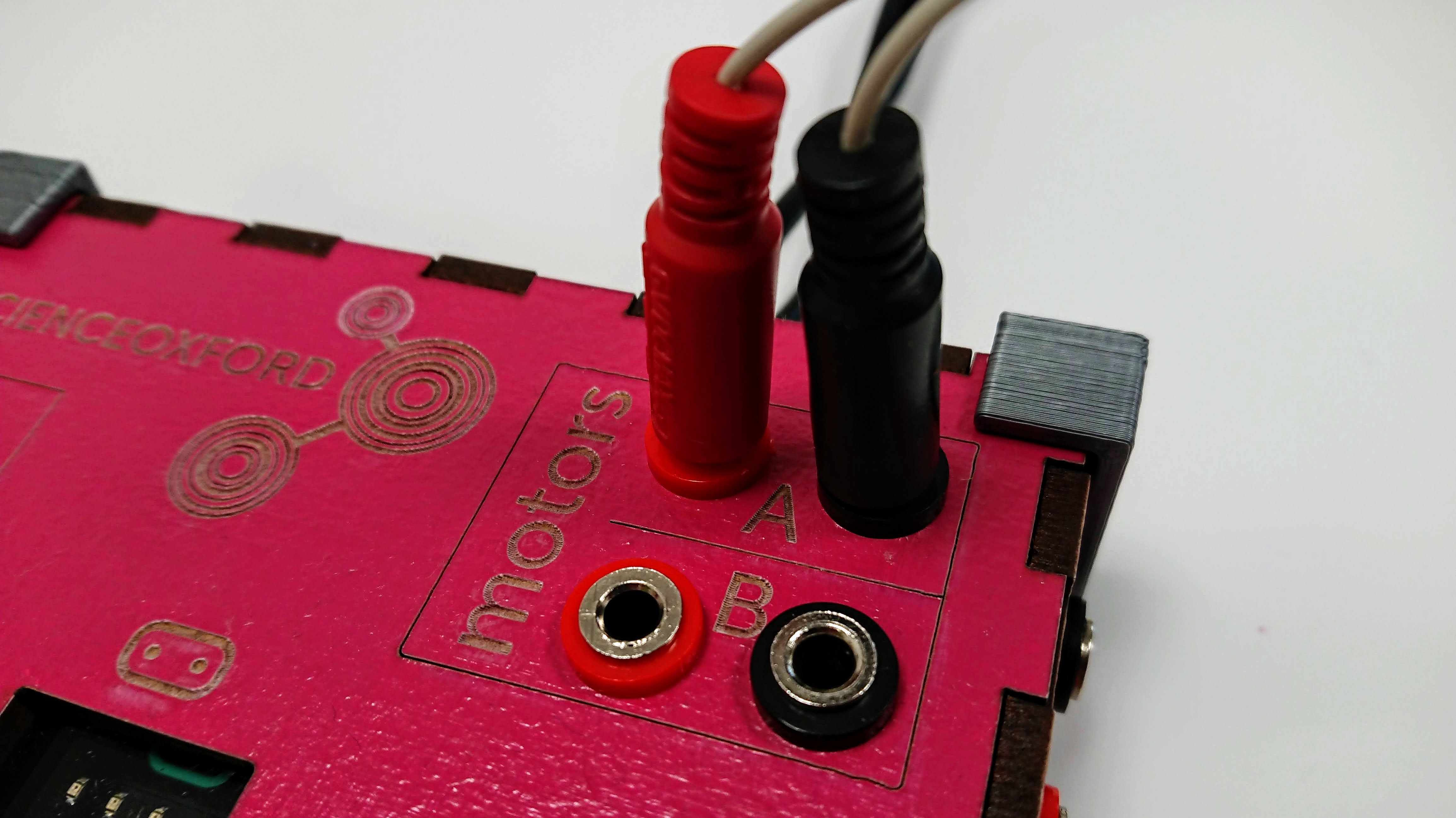 two wires in two plug sockets - red to red, black to black